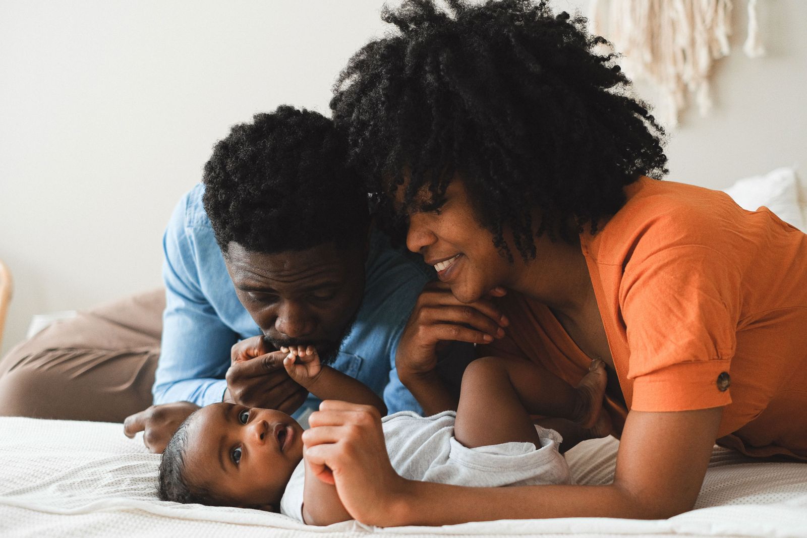 Parents relaxing with their baby